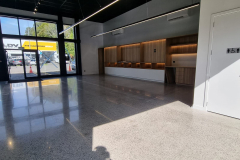 electric-car-showroom-ebbets-polished-concrete-floor-before-and-after-nz-grinders-6-1