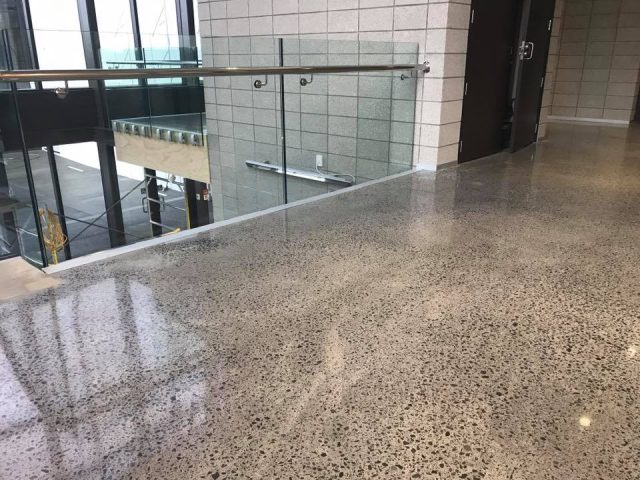 How do you keep polished concrete floors shiny?