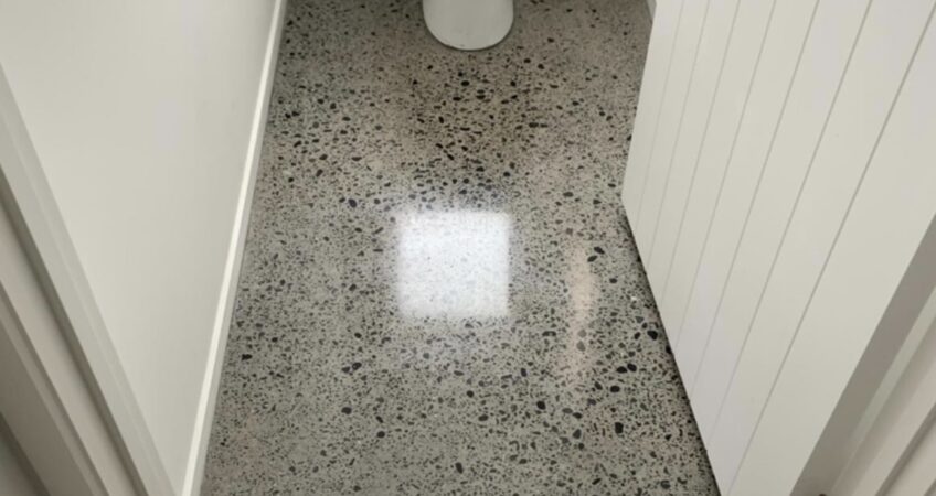 Toilet floor polished concrete grind and seal
